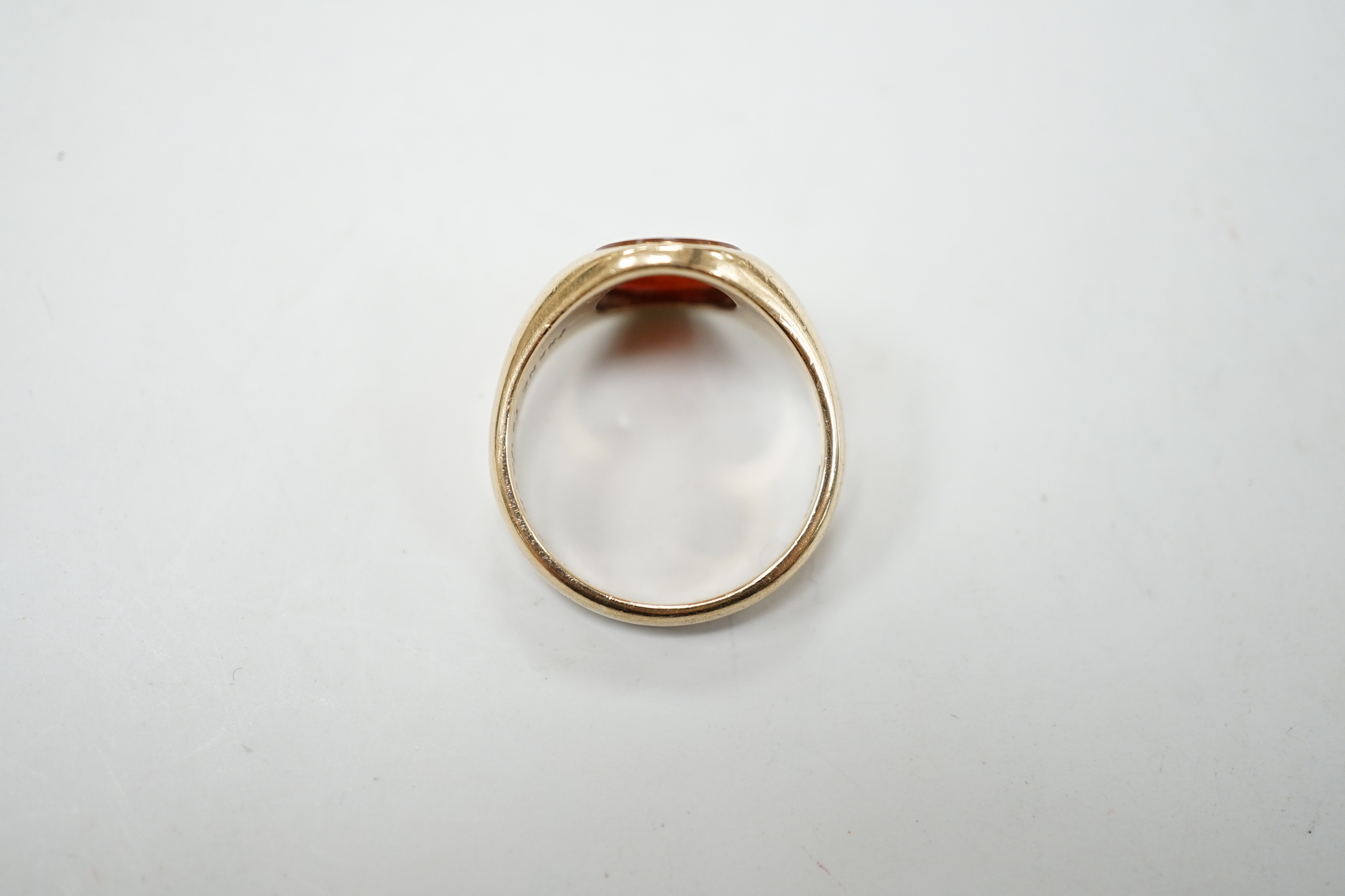 A 1930's 9ct gold and carnelian set oval signet ring, size Q, gross weight 5.7 grams.
